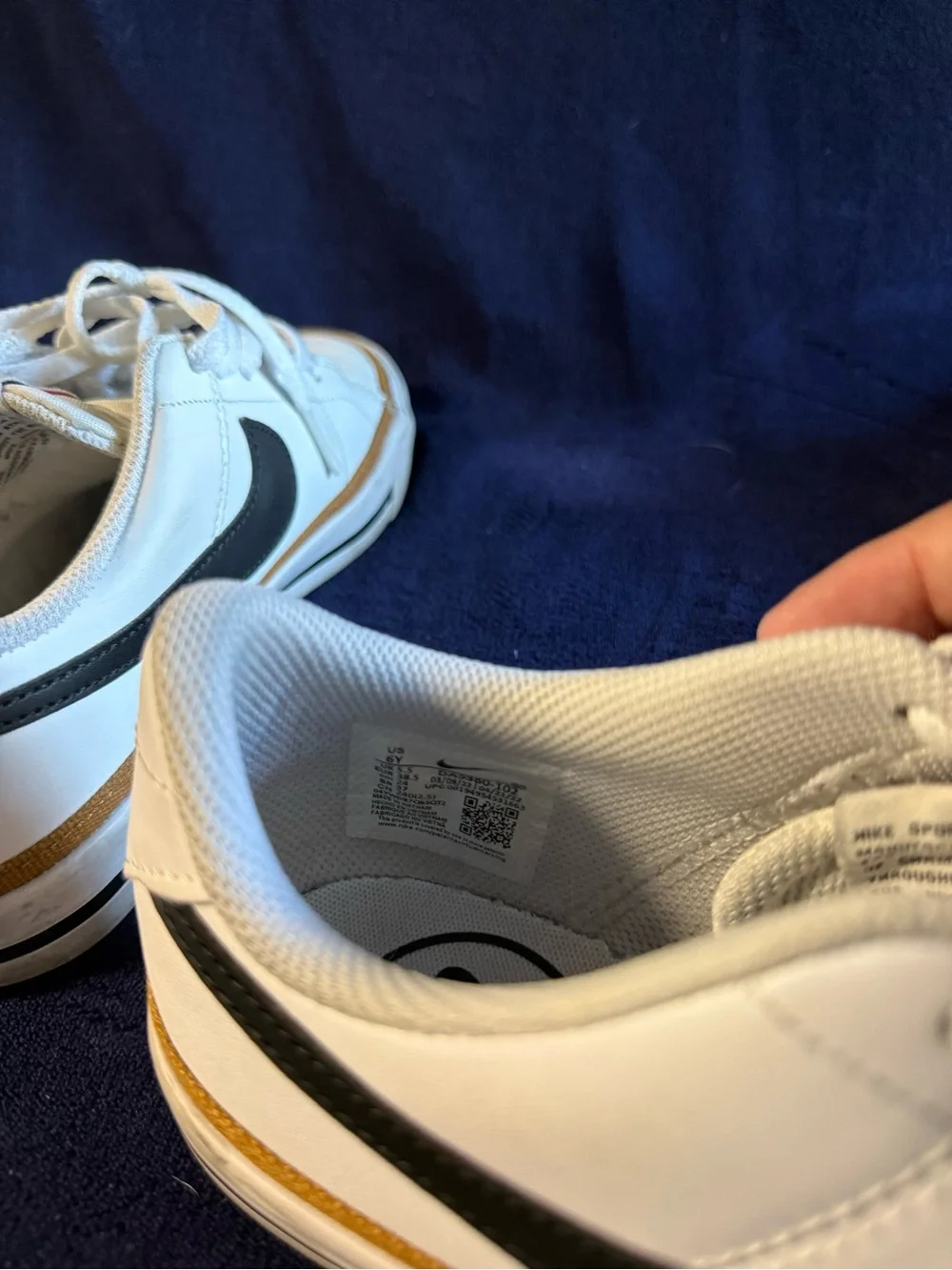 Nike Men’s White Low-Top Sneakers with Black Swoosh and Gold Trim